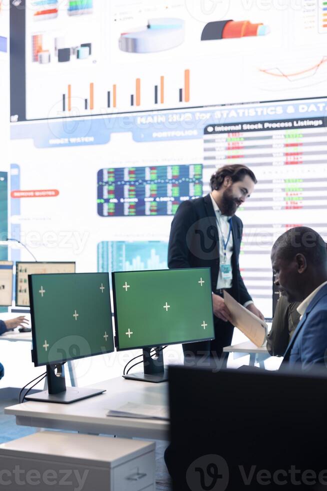 Business analyst examining monthly results and performance metrics online, isolated screen in multinational company headquarters. Consultant reviews income and expenditure budget. photo