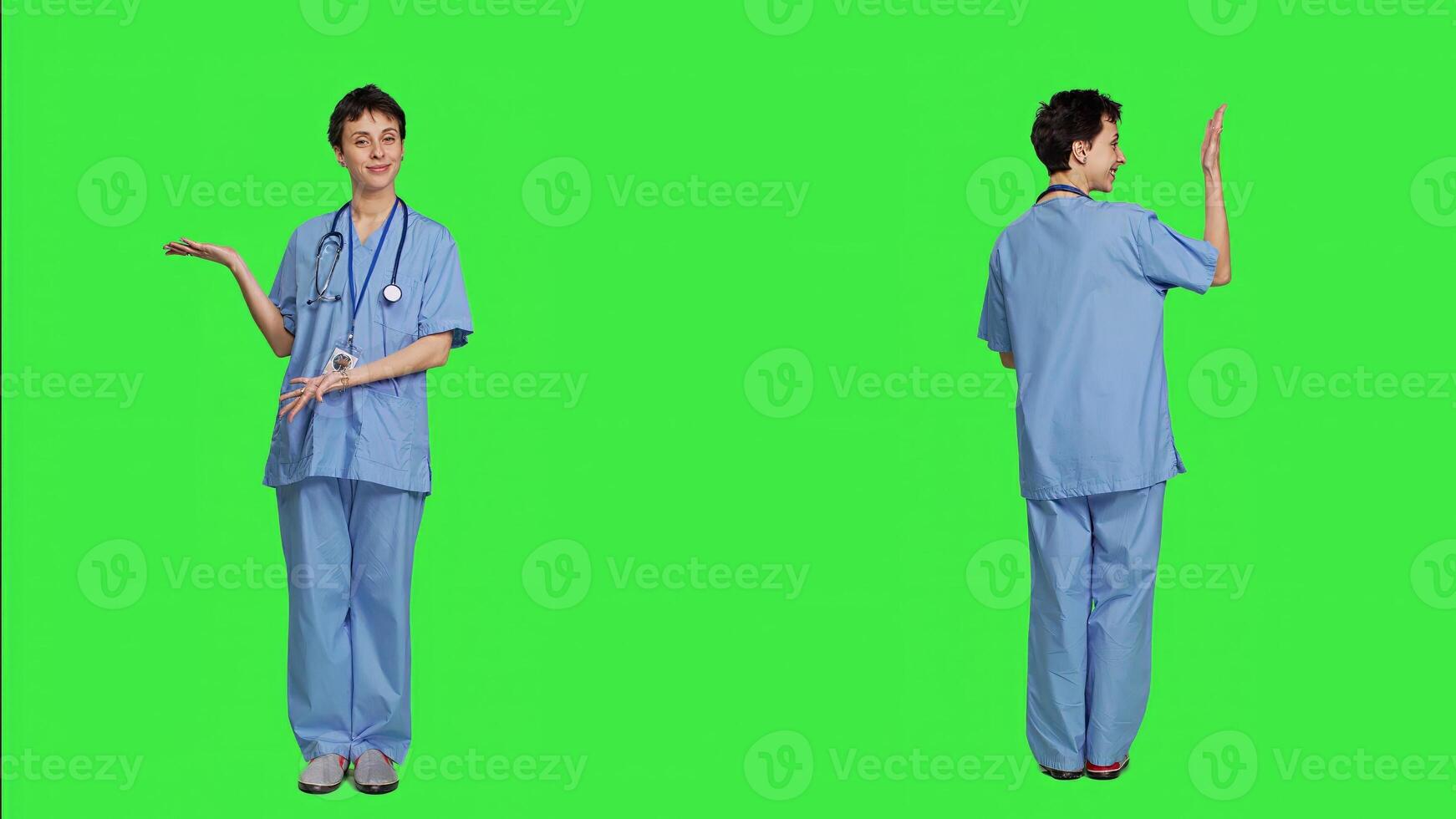 Healthcare specialist presenting a thing for promotional ad in studio, pointing at something against greenscreen backdrop. Medical assistant creating a web commercial, health expertise. Camera A. photo