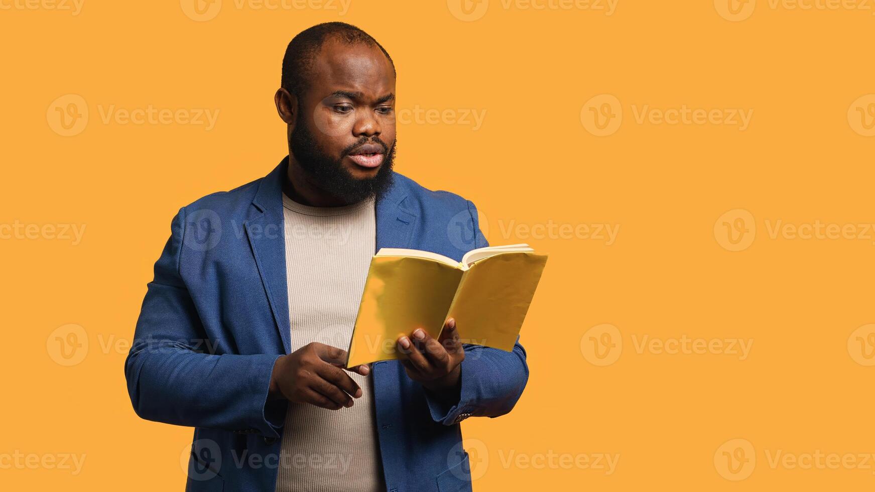 Man reading book aloud, narrating story for audience. Person enjoying literature novel, reciting from pages, entertaining spectators, isolated over studio background, camera A photo