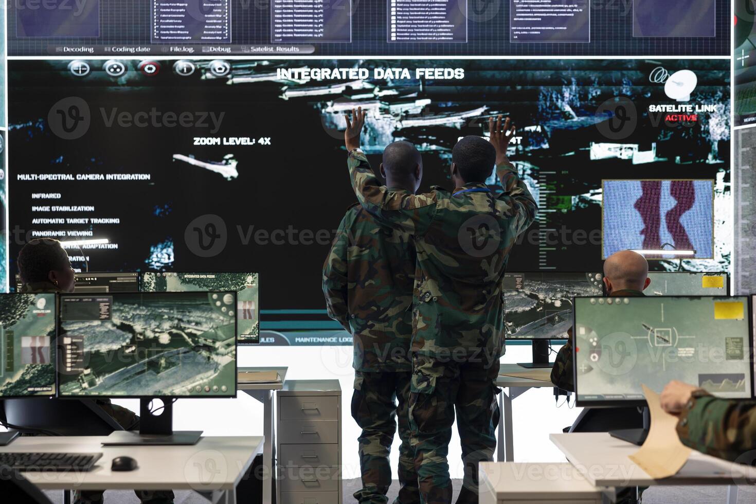 Infantry unit soldiers team studying satellite radar intelligence for a mission, creating an attack plan before going into the field. Skilled army recruits receiving crucial battlefield information. photo