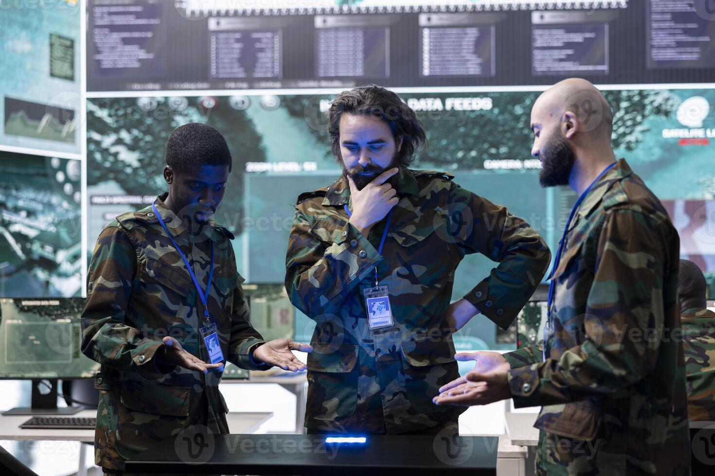 Squad of diverse troopers reviewing crucial real time data on a hologram, discussing ideas for a defense operation. Professional infantry unit soldiers work with holographic projection. photo