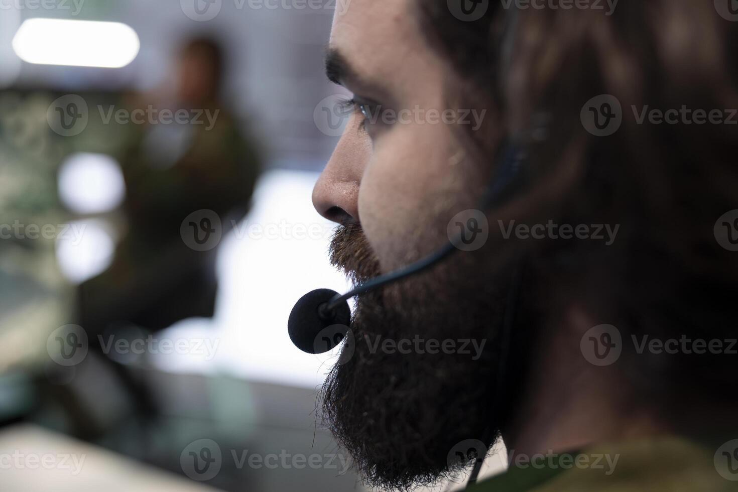 Army recruit working on reconnaissance mission to gather intelligence, operating with global satellite system for surveillance. IT operator working in military headquarters power base. Close up. photo