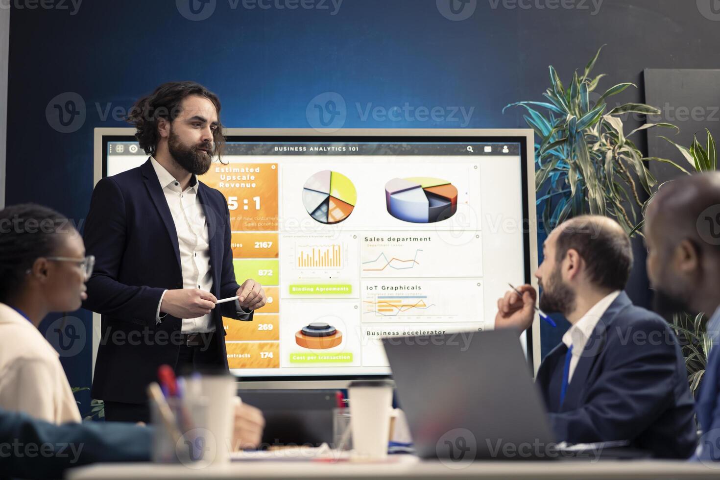 Financial expert briefing his staff members about new corporate objectives, presenting their budget and expenses on an interactive board. Resource allocation and project planning. photo