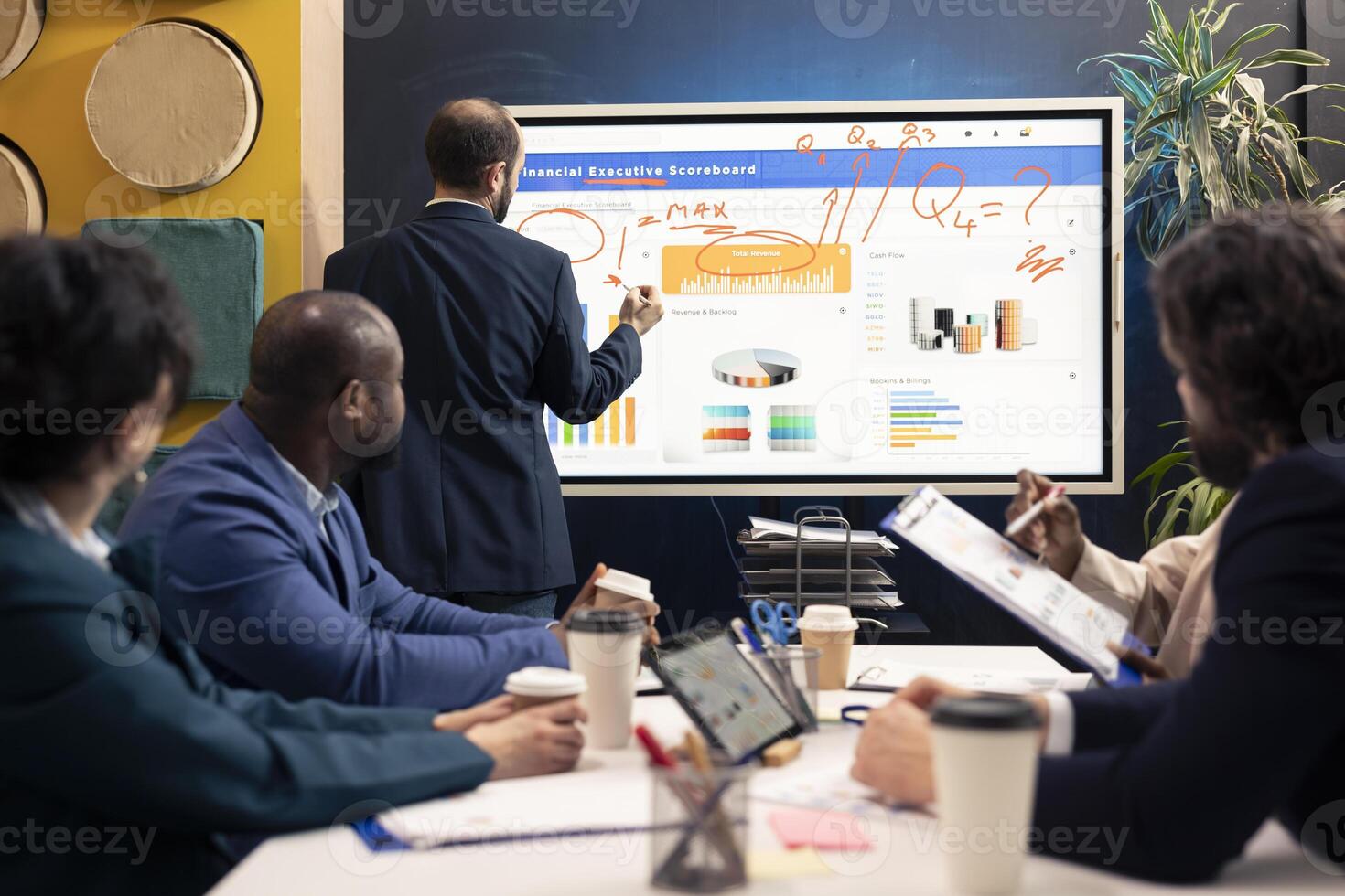 Executive officer examines infographics on sales to review supply and demand, working with his team to increase enterprise funding and develop the business activity internationally. photo