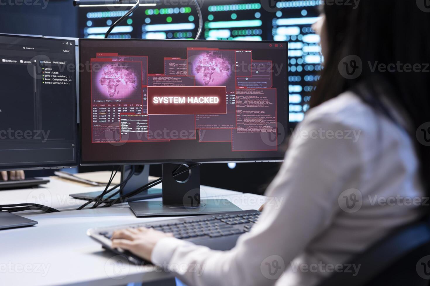 System administrator in server room frightened by sensitive data threatened by hacking attack on computers. Woman afraid of cyberattack, struggling to save data center from unauthorized access photo