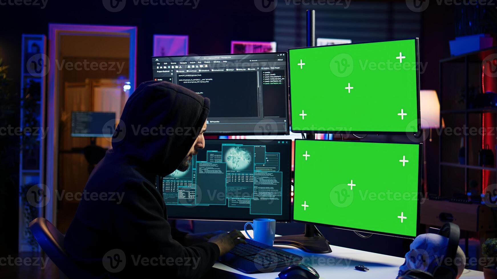 Hacker developing spyware software on green screen computer to steal important data to be sold on black market. Hooded scammer writing malicious code on chroma key PC, camera B photo