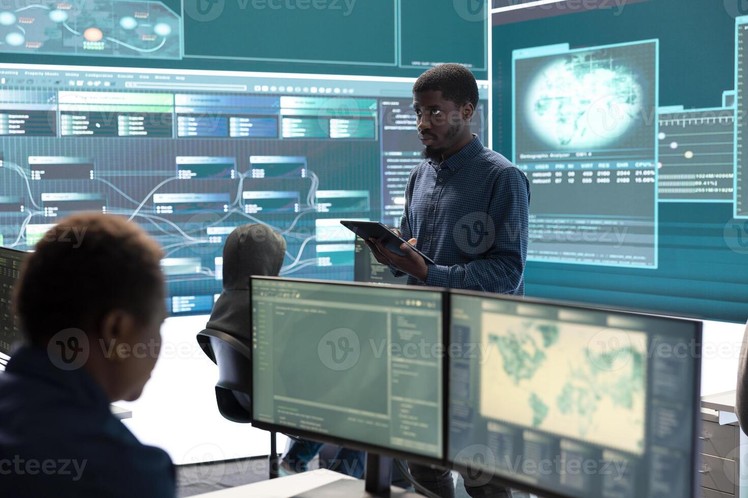 Governmental agency cyber defense team analyzing cyber attacks. IT security professionals working to prevent data breaches and protect against cybercrime, securing digital information. photo
