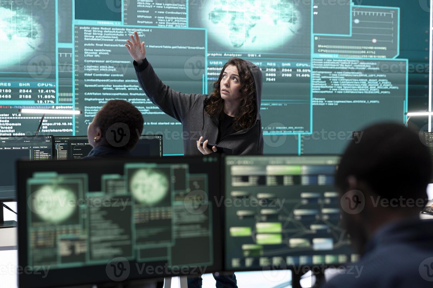 Cyber security specialist conducting cyber surveillance and threat detection in a governmental agency. Professional hackers team managing cybercrime prevention and malware detection. photo