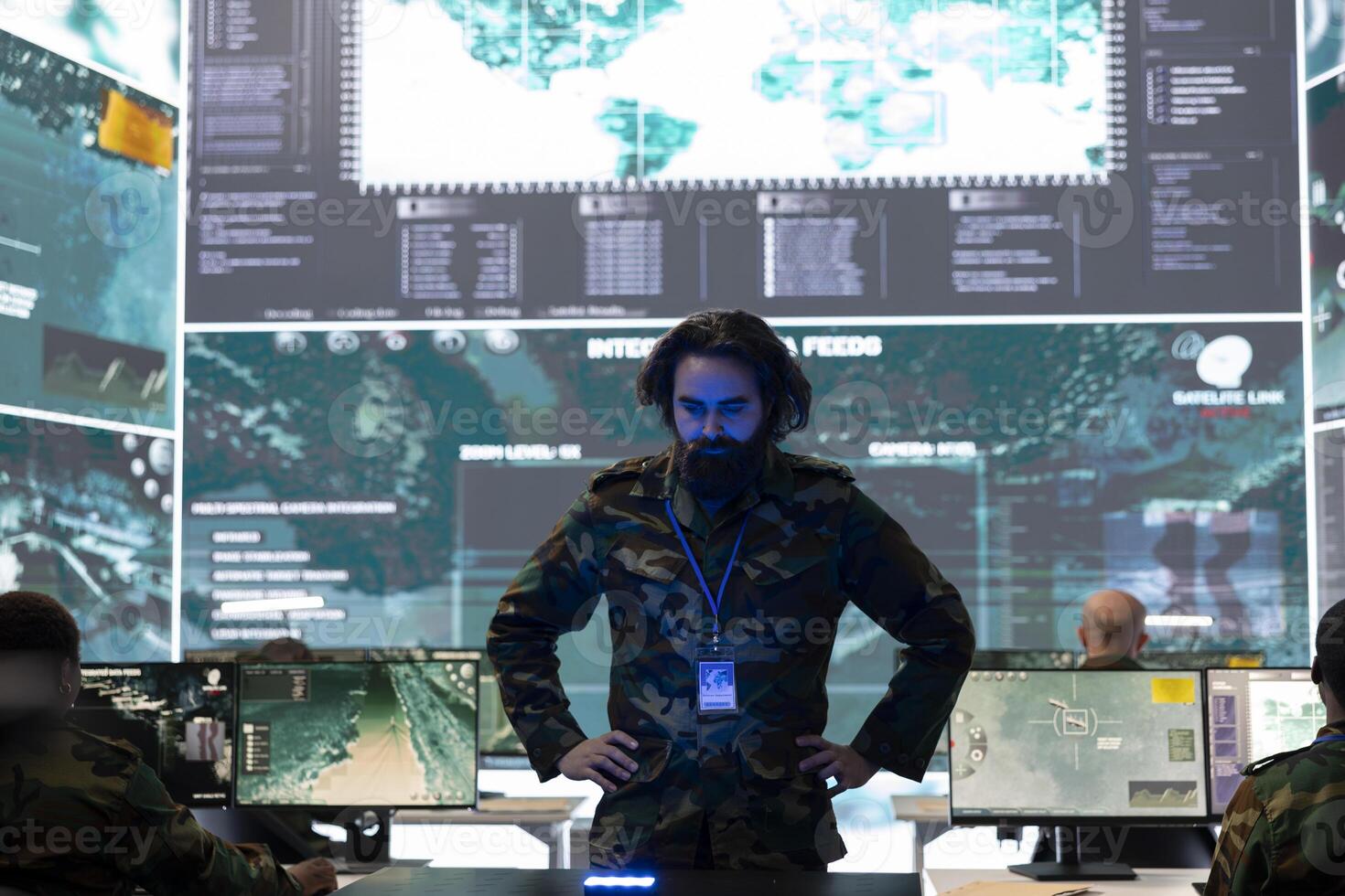 Special operations engineer reviewing battlefield data on a hologram, working with high tech holographic projection in military command center. Soldier checking defense operation objectives. photo