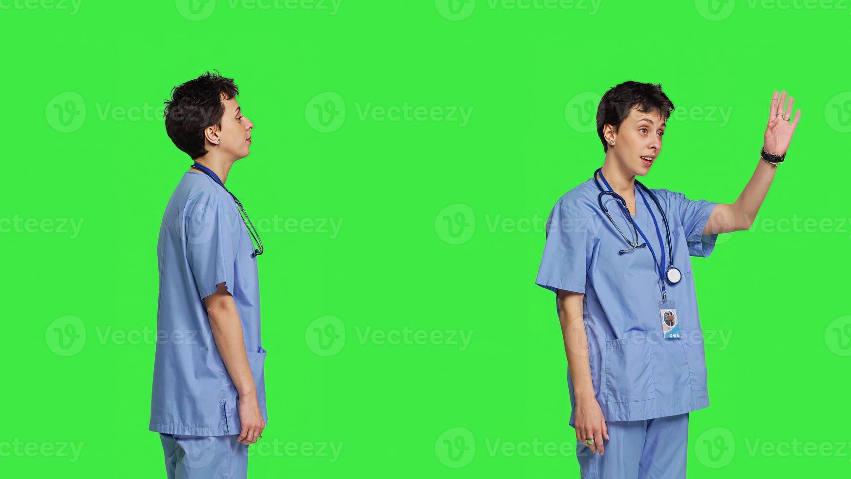 Woman nurse waving hello and inviting people to come closer, calling over patients for checkup examinations against greenscreen. Medical assistant greeting persons and asking them to come. Camera B. photo