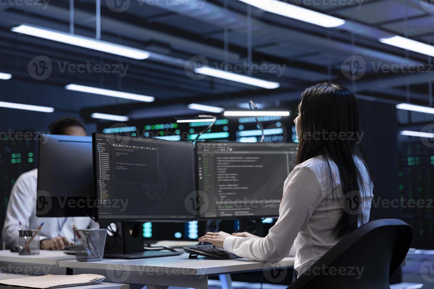 Software developers in data center running system diagnostic tests on PC to fix problems. IT staff members deploying and error checking utilities on computers to repair network issues performance photo