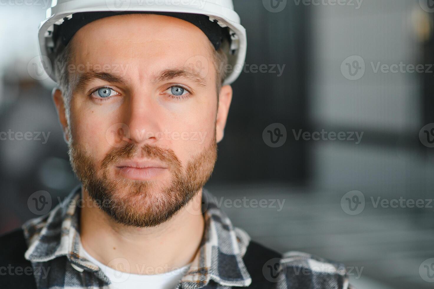portrait of a confident worker in a factory photo