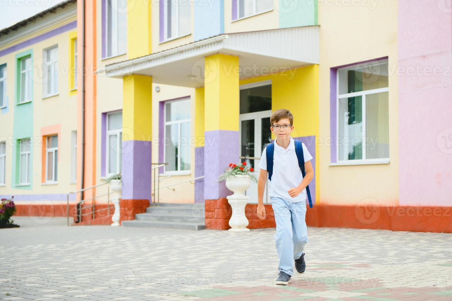 Portrait of boy going to school lessons on sunny summer day photo