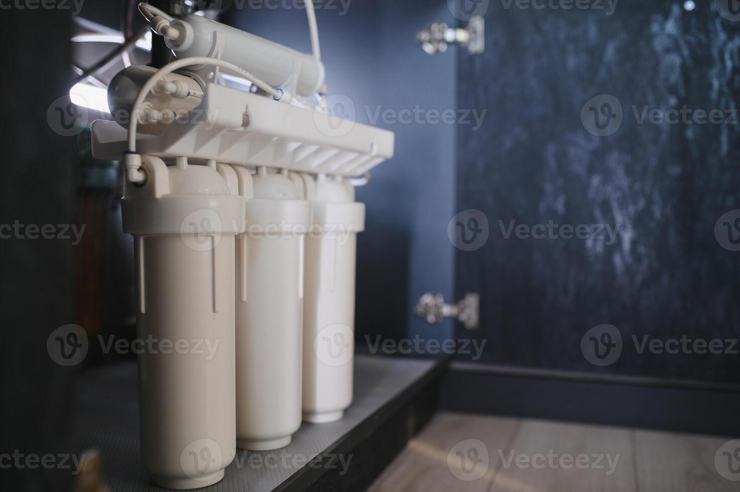 Reverse osmosis water purification system at home. Installed water purification filters. Clear water concept photo