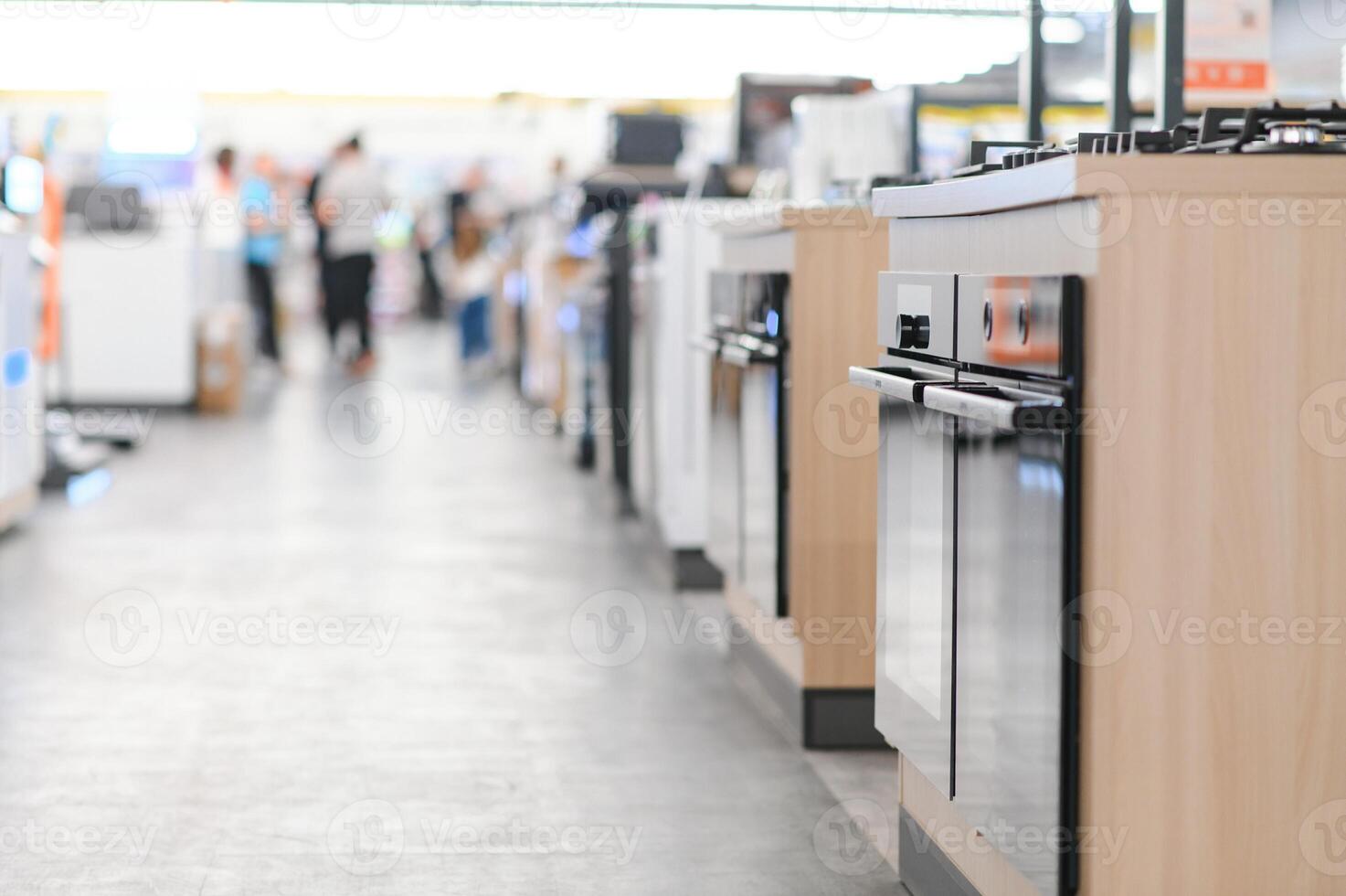 rows of gas stoves selling in home appliance store photo