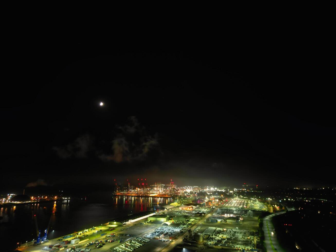 Aerial View of Illuminated Southampton Docks and Port City Centre During Dark Night. England United Kingdom. High Angle Drone's Camera Footage Captured from High Altitude on May 16th, 2024 photo