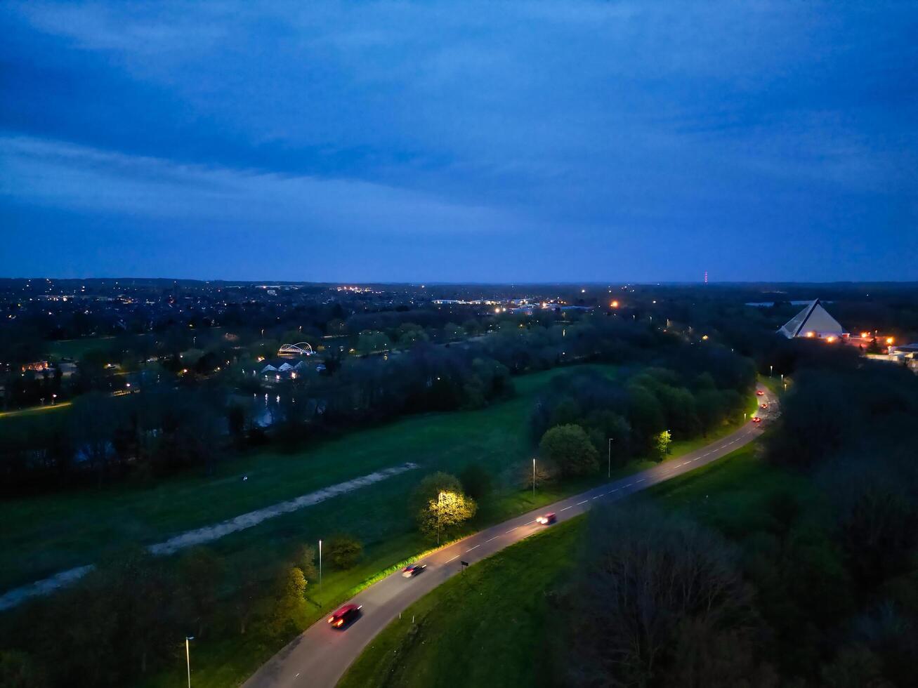 Aerial View of Illuminated Central Bedford City of England United Kingdom During Night. April 5th, 2024, High Angle Footage Was Captured after Sunset and Beginning of Night with Drone's Camera photo
