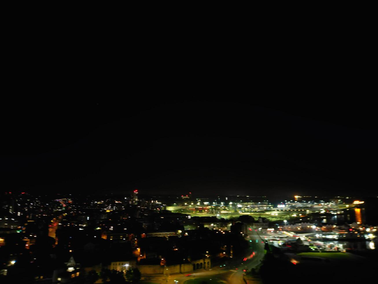Aerial View of Illuminated Southampton Docks and Port City Centre During Dark Night. England United Kingdom. High Angle Drone's Camera Footage Captured from High Altitude on May 16th, 2024 photo