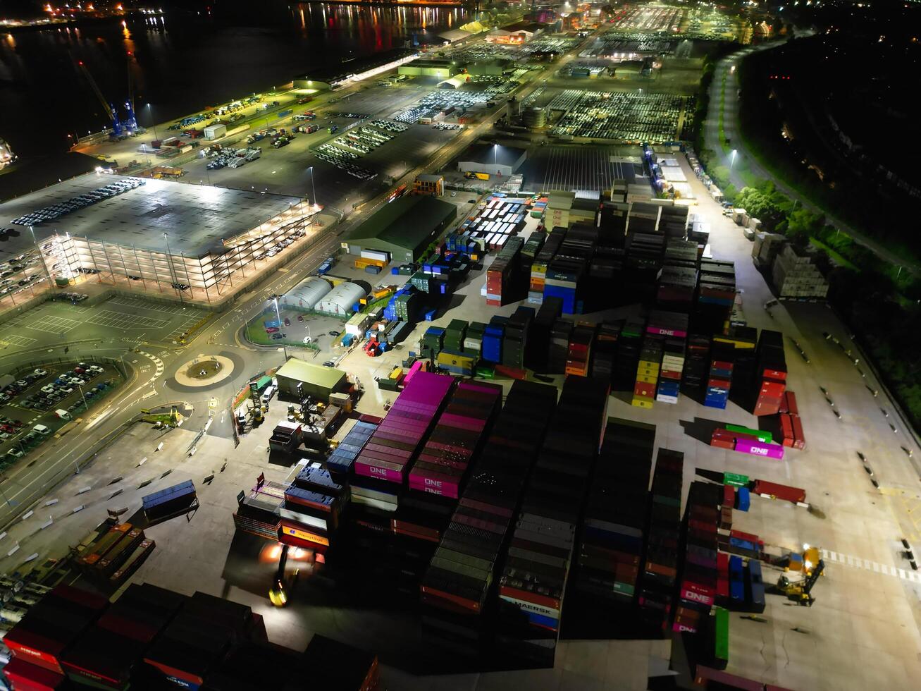 Aerial View of Illuminated Southampton Docks and Port City Centre During Dark Night. England United Kingdom. High Angle Drone's Camera Footage Captured from High Altitude on May 16th, 2024 photo