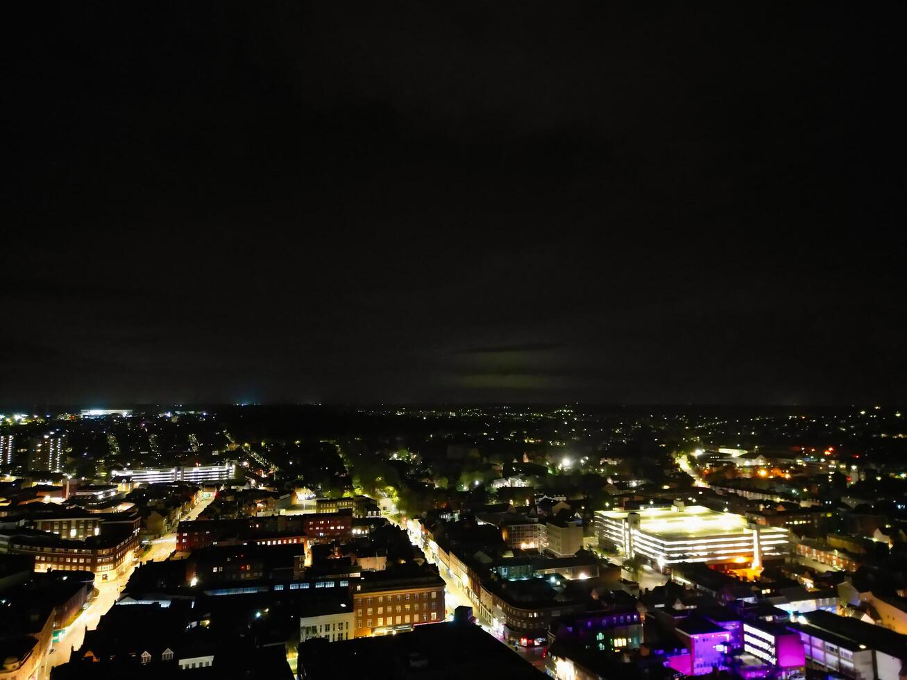 Aerial View of Illuminated Central Bedford City of England United Kingdom During Night. April 5th, 2024, High Angle Footage Was Captured after Sunset and Beginning of Night with Drone's Camera photo