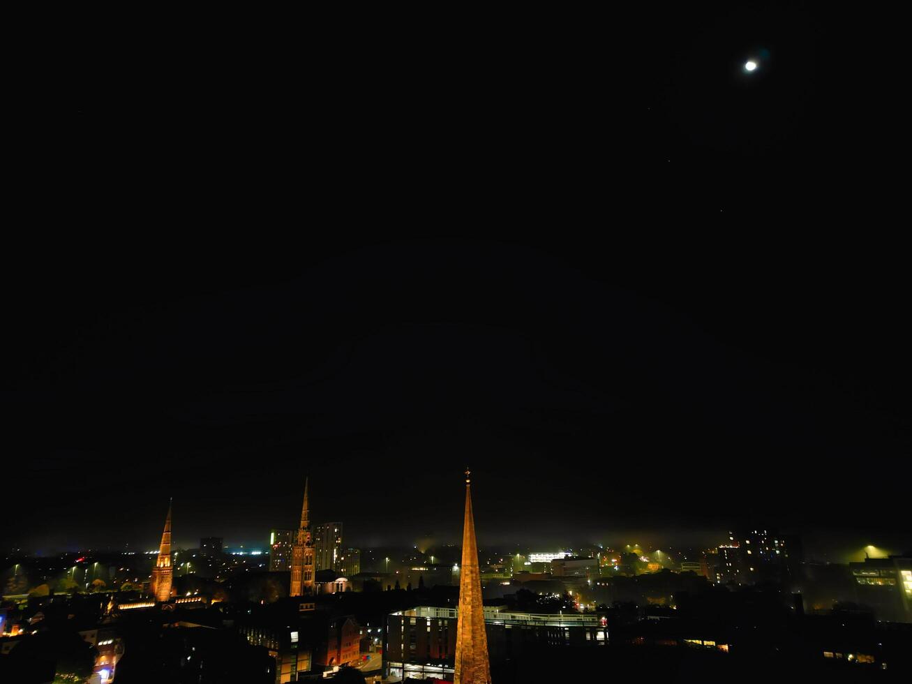 High Angle View of Illuminated Historical Central Coventry City Centre Downtown of England United Kingdom. Aerial footage Was Captured on After Midnight with Drone's Camera on October 23rd, 2024 photo