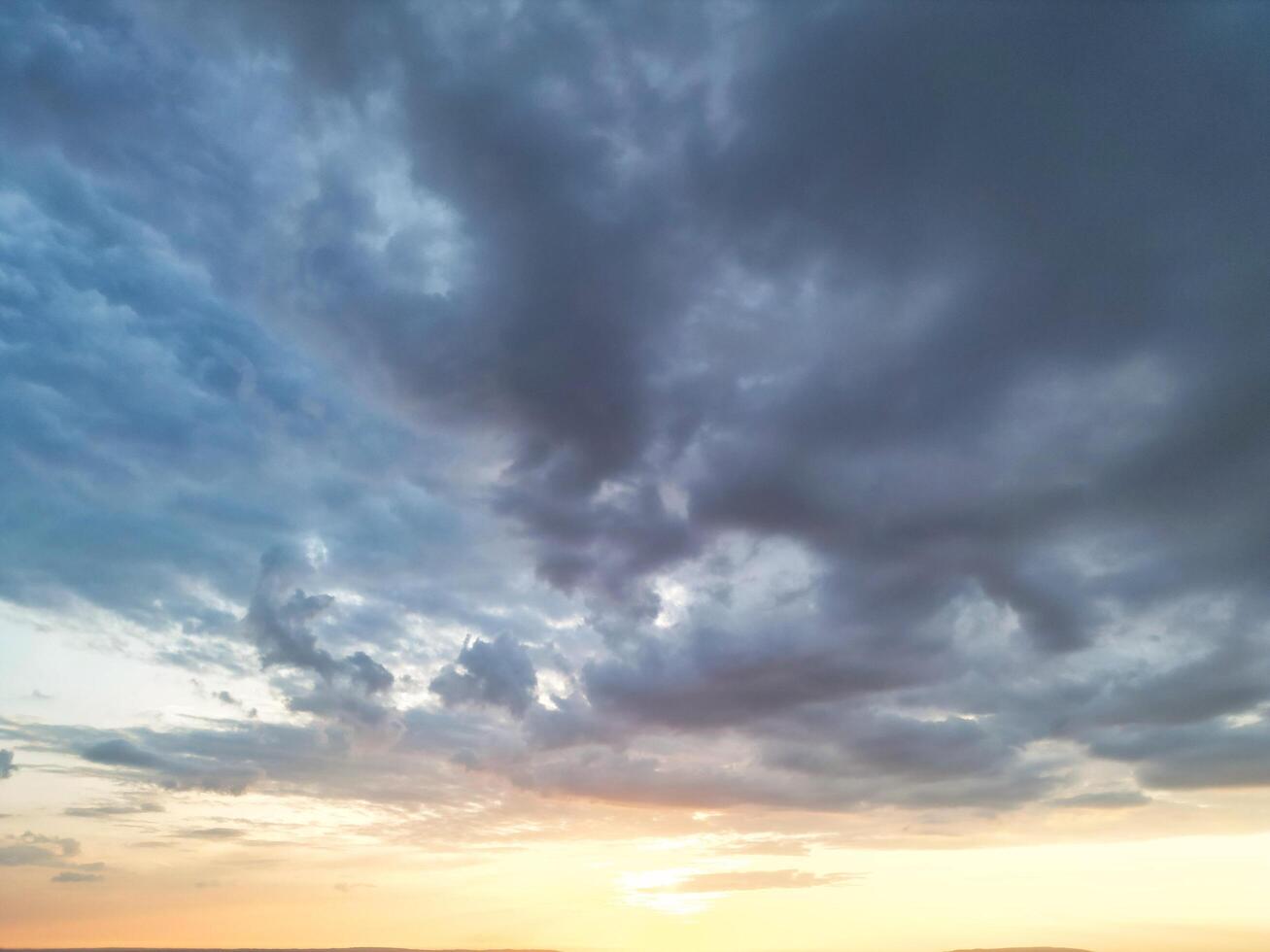 Unique and Dramatic Clouds and Sky over City of England Great Britain. Footage Was Captured with drone's Camera from High Altitude over Manchester City UK photo