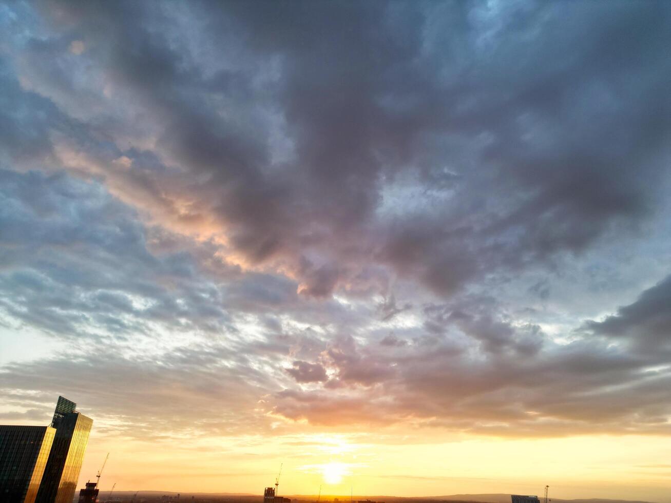 Unique and Dramatic Clouds and Sky over City of England Great Britain. Footage Was Captured with drone's Camera from High Altitude over Manchester City UK photo