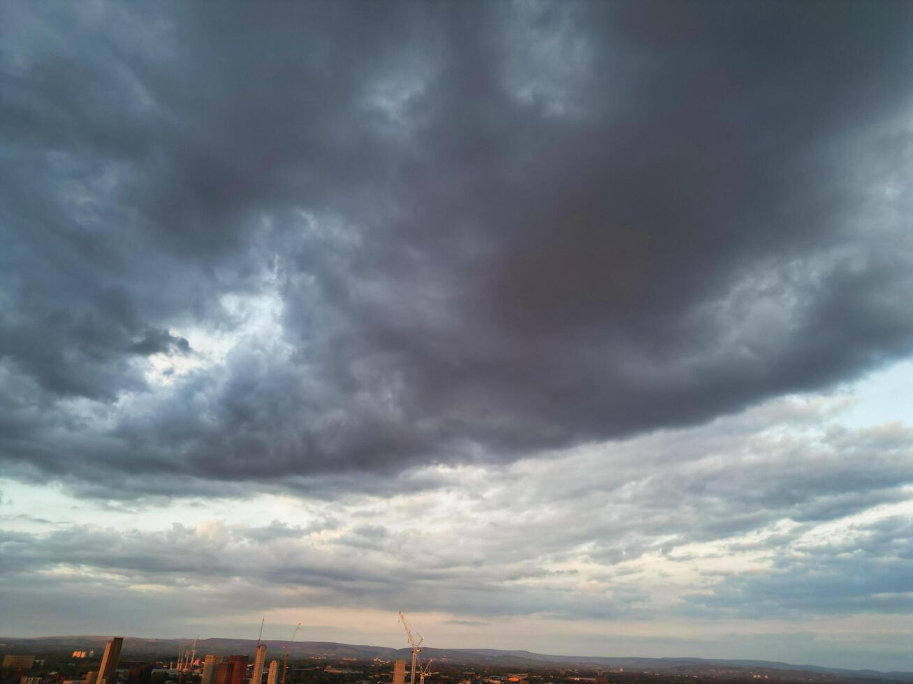 Unique and Dramatic Clouds and Sky over City of England Great Britain. Footage Was Captured with drone's Camera from High Altitude over Manchester City UK photo