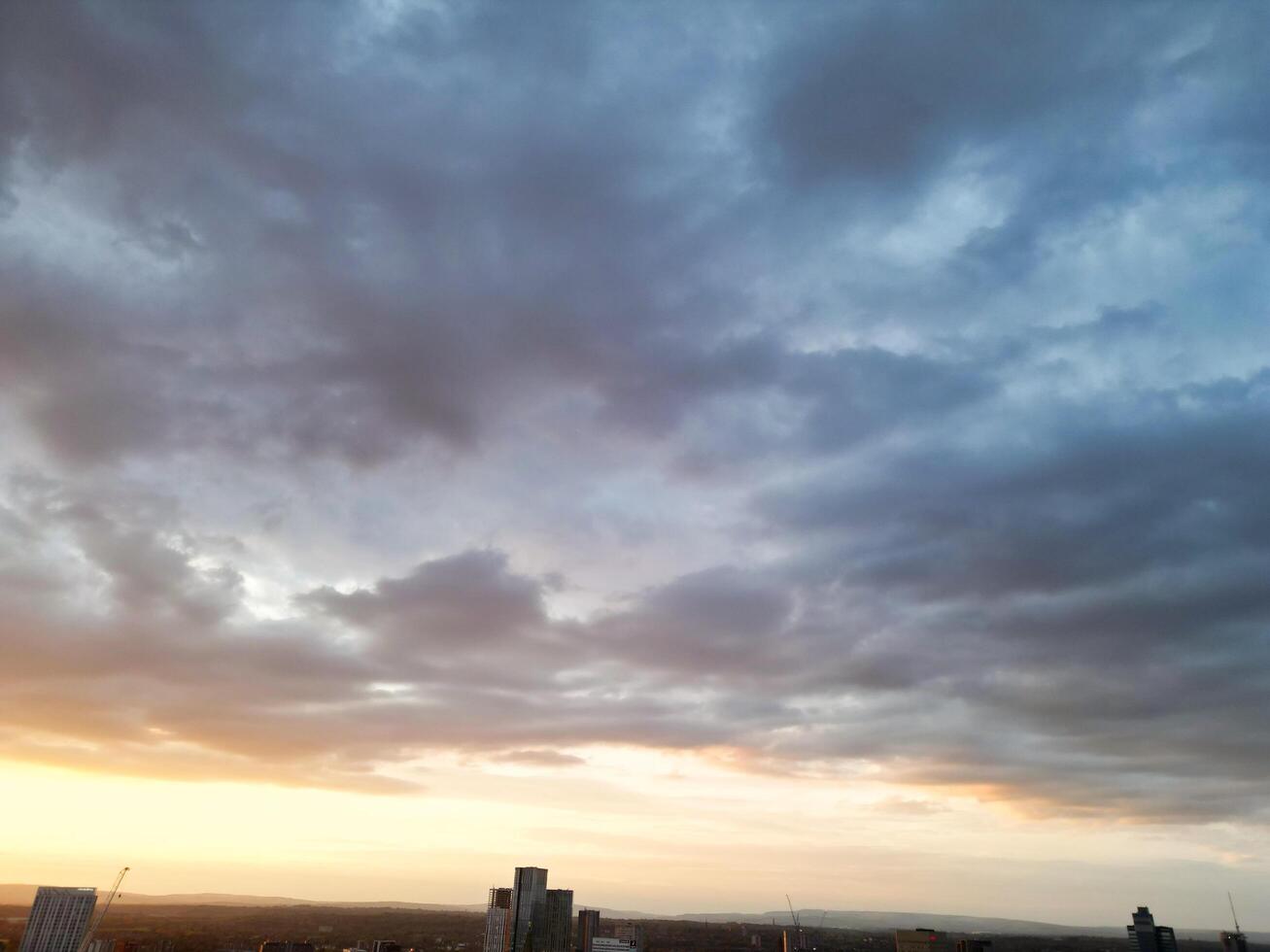 Unique and Dramatic Clouds and Sky over City of England Great Britain. Footage Was Captured with drone's Camera from High Altitude over Manchester City UK photo
