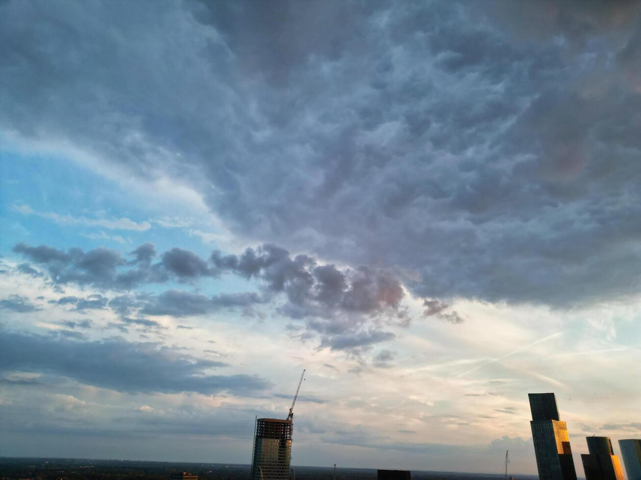 Unique and Dramatic Clouds and Sky over City of England Great Britain. Footage Was Captured with drone's Camera from High Altitude over Manchester City UK photo