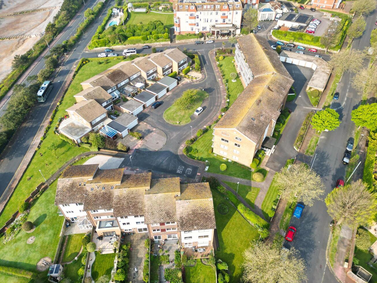 High Angle View of Historical Central Eastbourne Buildings and City of England, United Kingdom. Aerial Footage Was Captured with Drone's Camera During Windy Day on May 11th, 2024 photo
