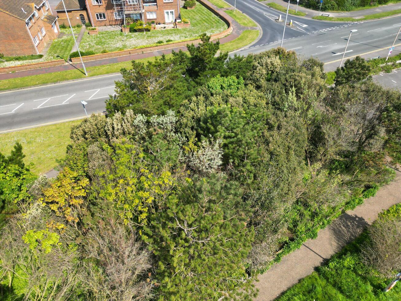 High Angle View of Historical Central Eastbourne Buildings and City of England, United Kingdom. Aerial Footage Was Captured with Drone's Camera During Windy Day on May 11th, 2024 photo