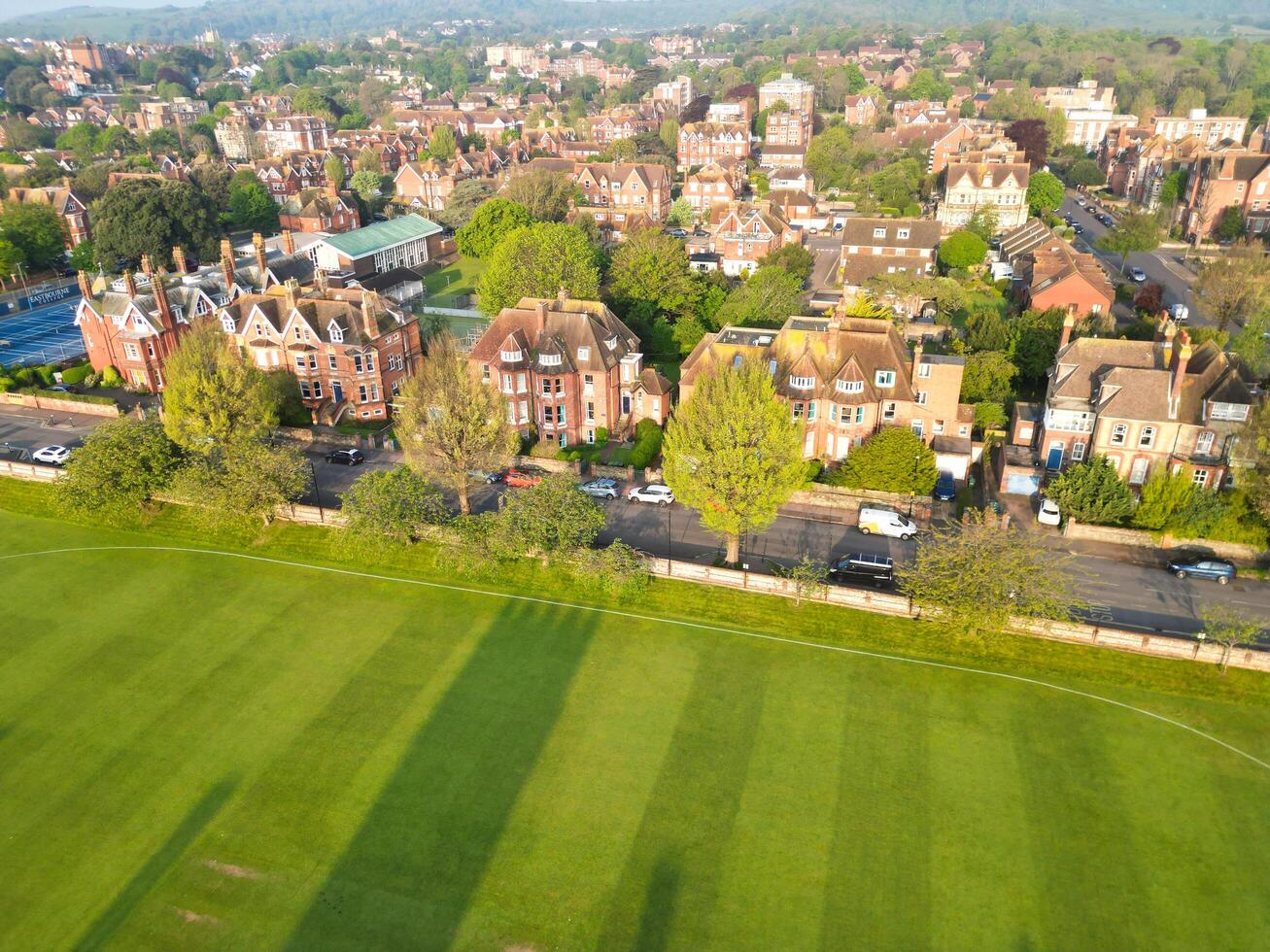 High Angle View of Historical Central Eastbourne Buildings and City of England, United Kingdom. Aerial Footage Was Captured with Drone's Camera During Windy Day on May 11th, 2024 photo