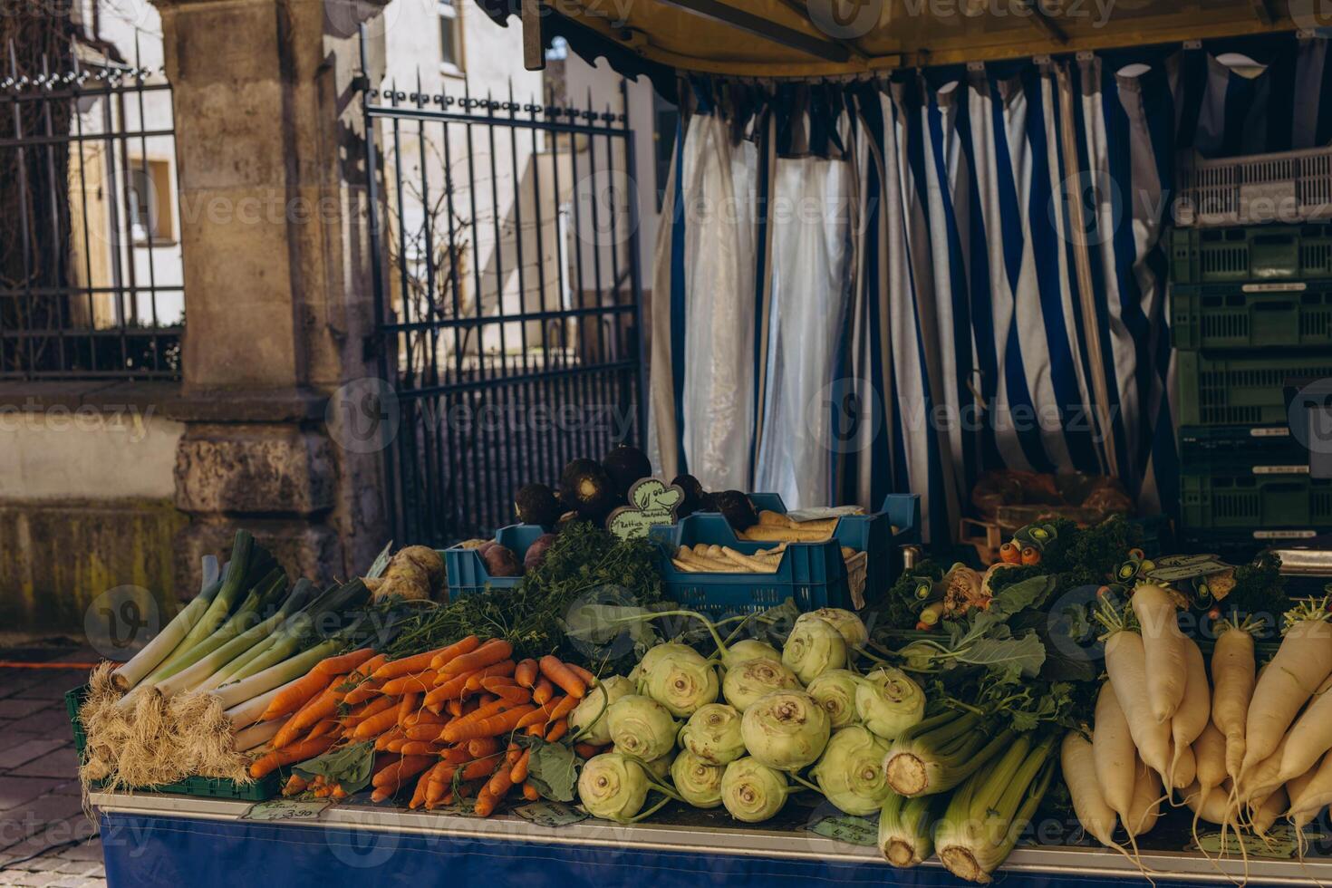 A market stall filled with fresh fruits on display, offering a colorful selection of produce. photo