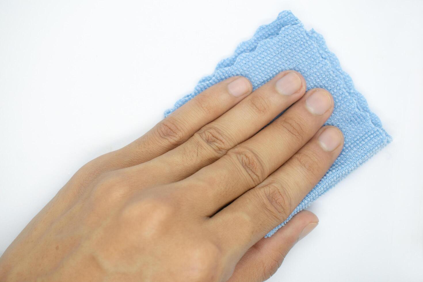 top view of hand with cleaning cloth isolated on white background photo