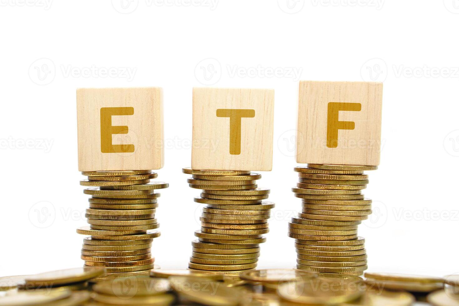 Pile of golden money coin on white background and text on wooden block. Business, profit and financial concept. photo