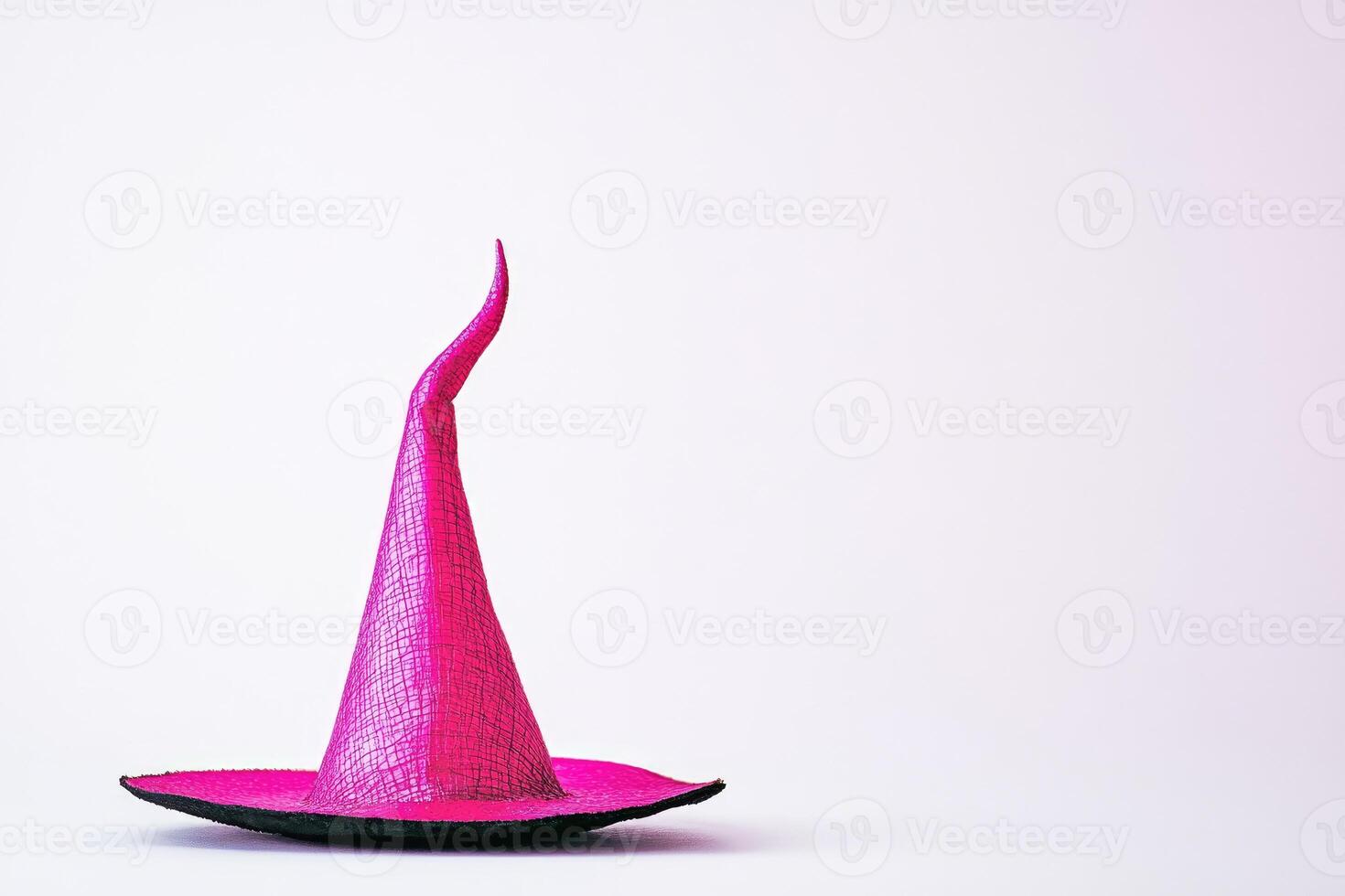 A Pink Witch's Hat Against a White Background photo