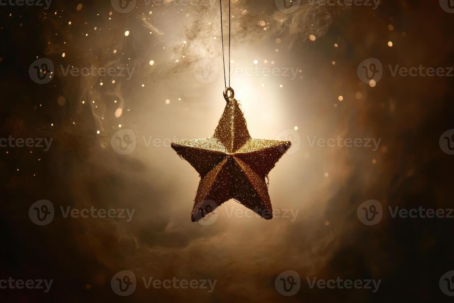 A Shiny Gold Star Ornament Hanging in a Smoky Atmosphere with Sparkling Lights photo