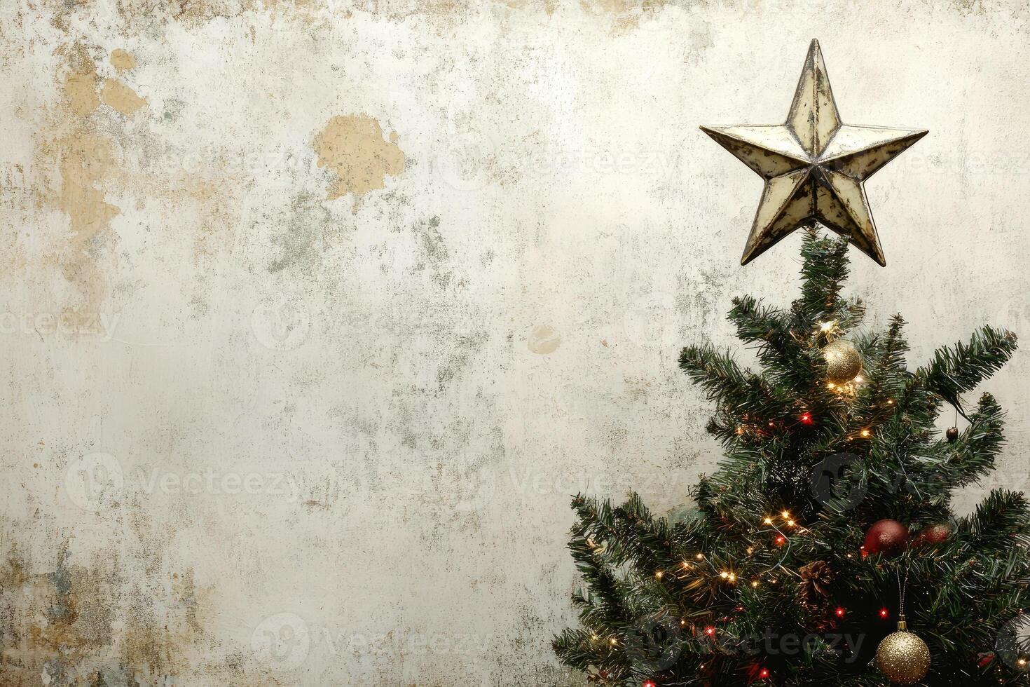 Decorated Christmas Tree with Rustic Star Topper Against a Weathered White Wall photo
