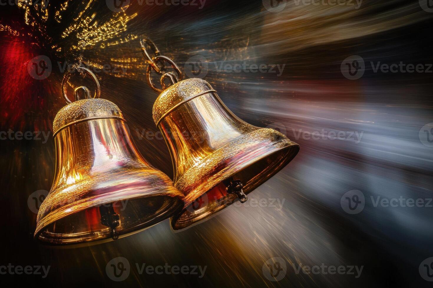 Two Golden Bells Against a Blurred Background of Light photo