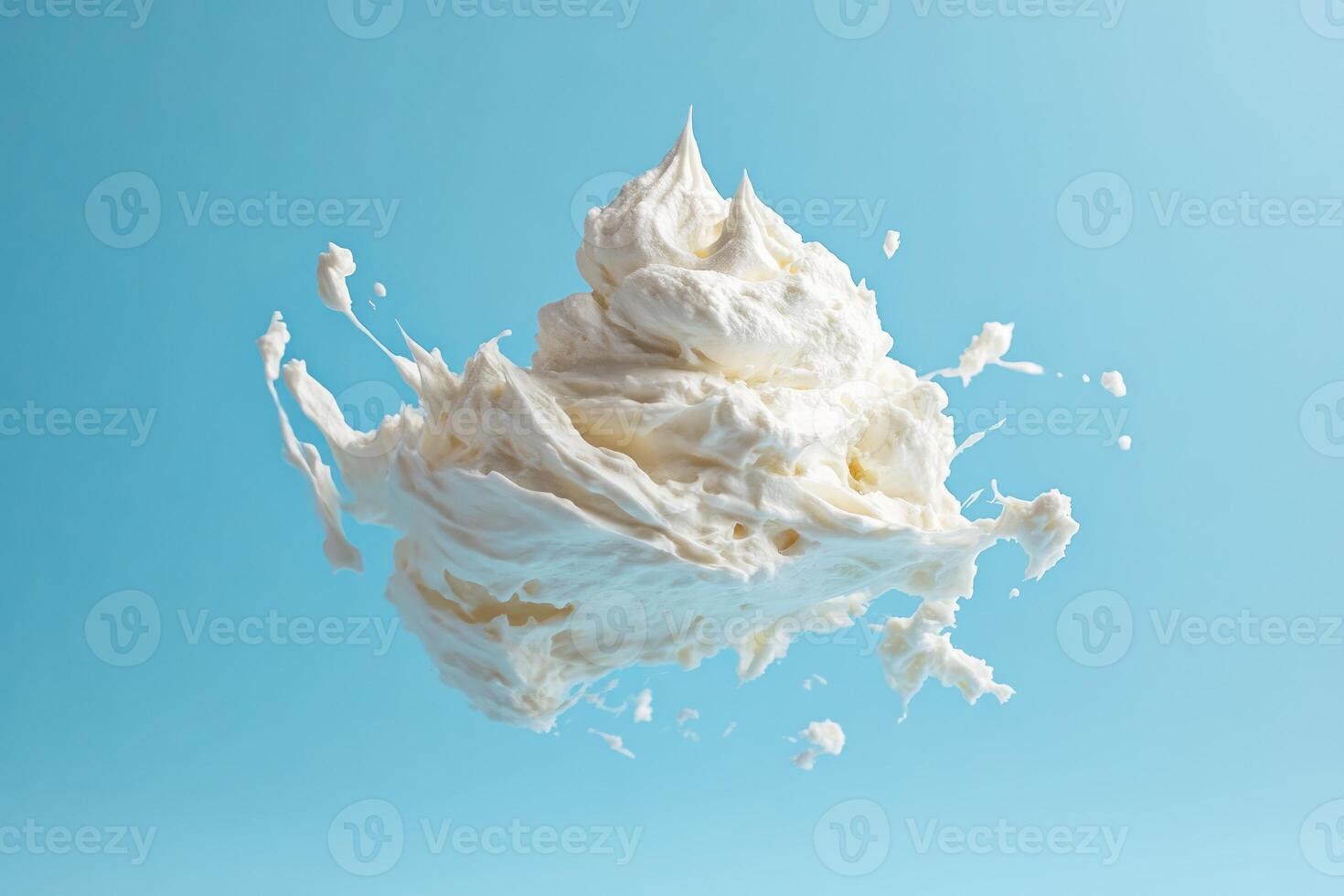 White Whipped Cream Splashing Against a Blue Background photo