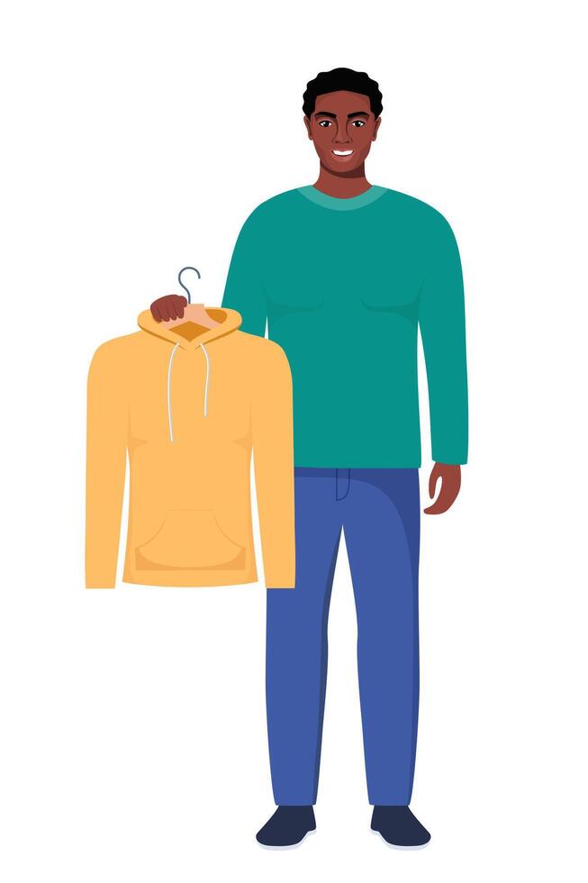 Smiling young black man holding hanger with yellow hoody. Choosing clothes concept. illustration in flat style. vector