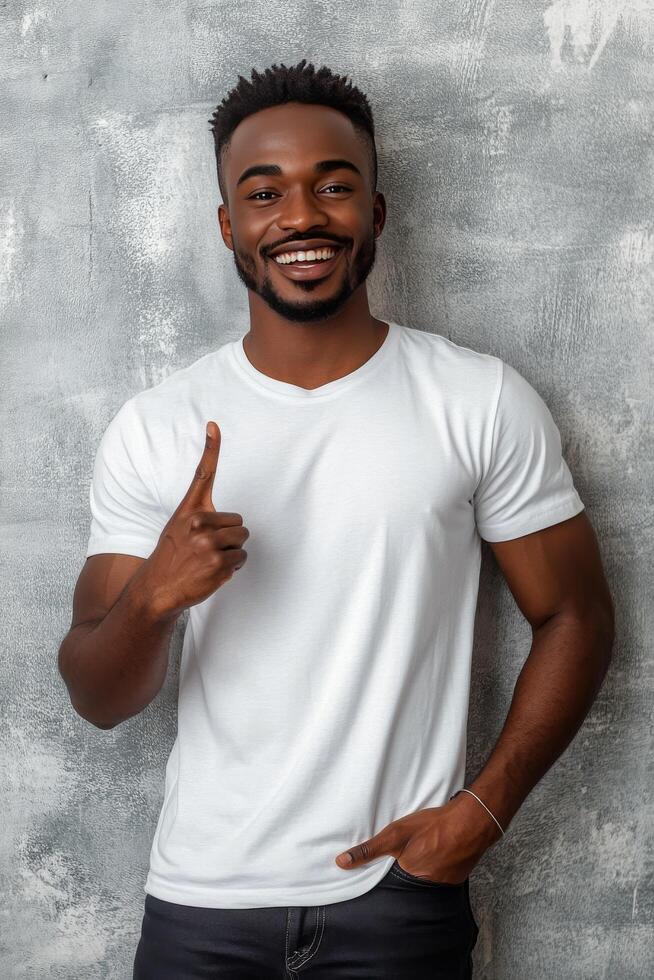 Young man showing number one gesture with a confident smile against a textured gray background photo