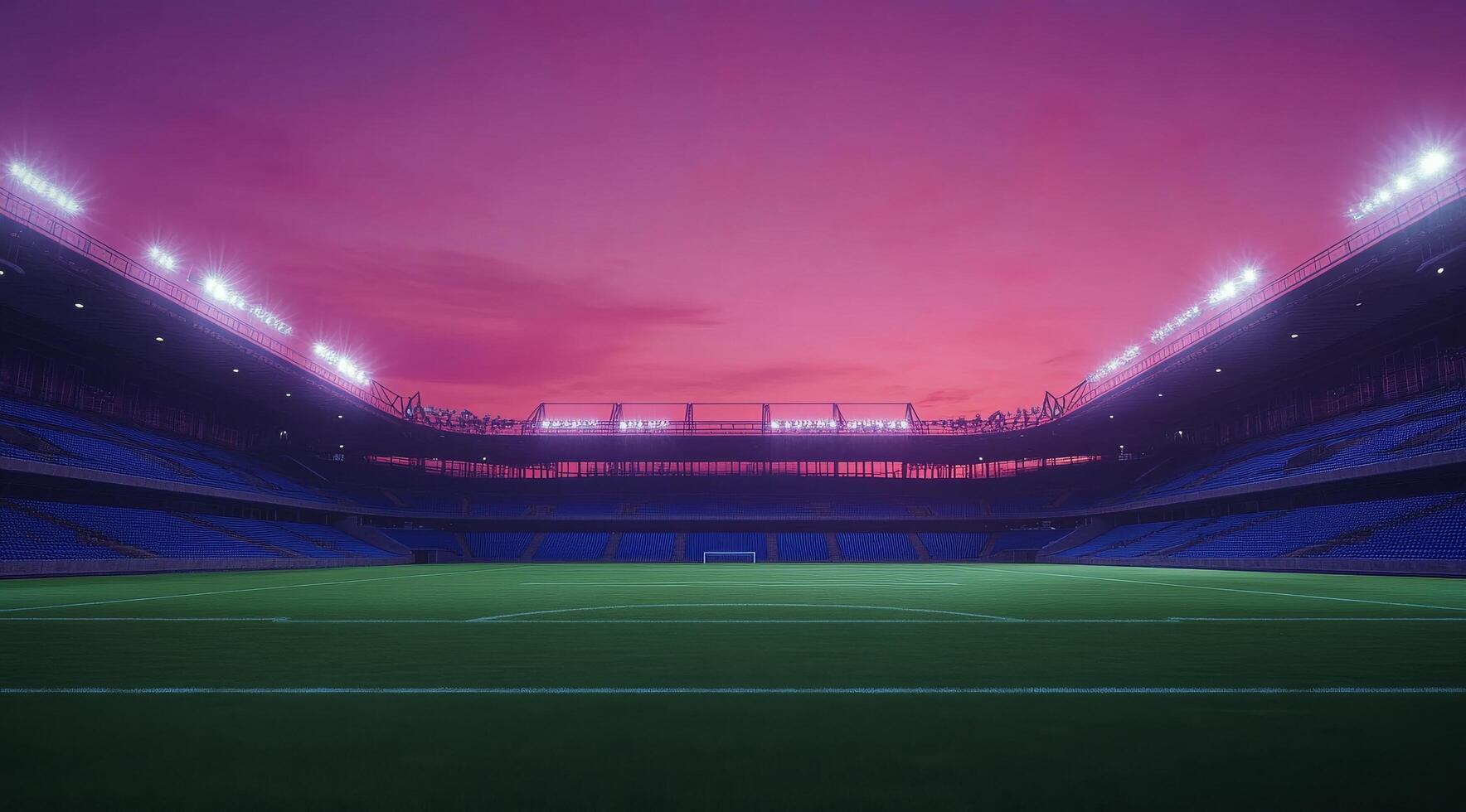 A vibrant sunset over an empty stadium with bright lights illuminating the pitch photo