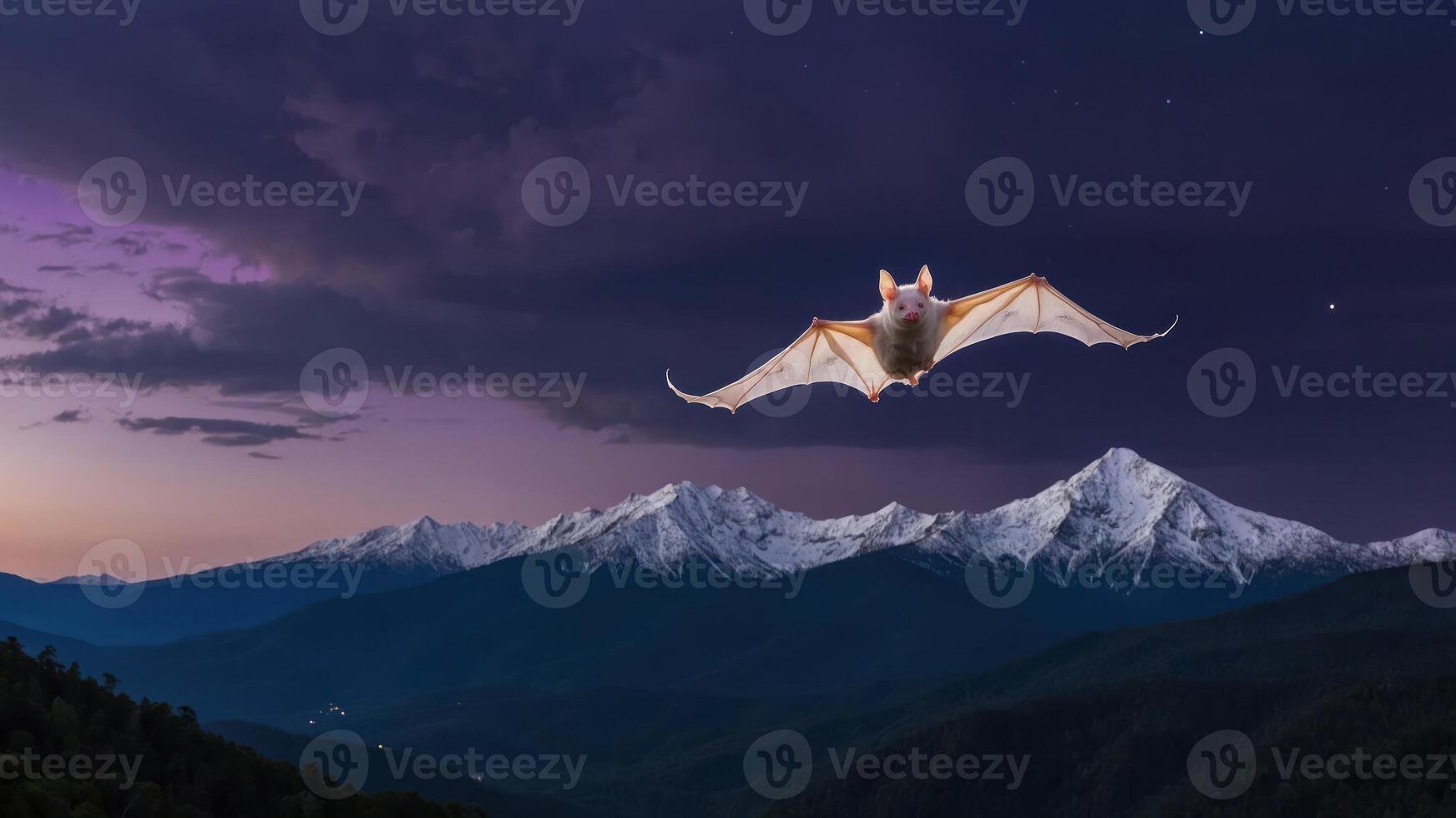 A bat flying over snow-capped mountains at twilight, showcasing nature's beauty. photo