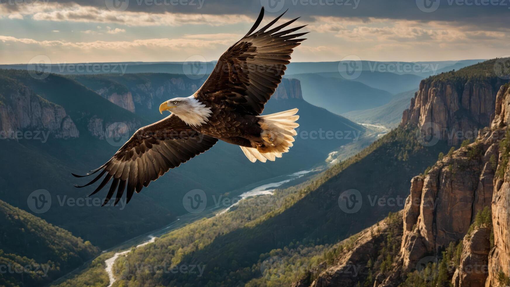 A majestic eagle soars over a breathtaking mountainous landscape with a winding river. photo
