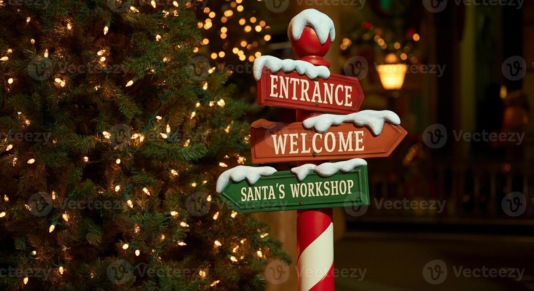 Signpost with Christmas signs and holiday decorations at Santa's Workshop entrance photo
