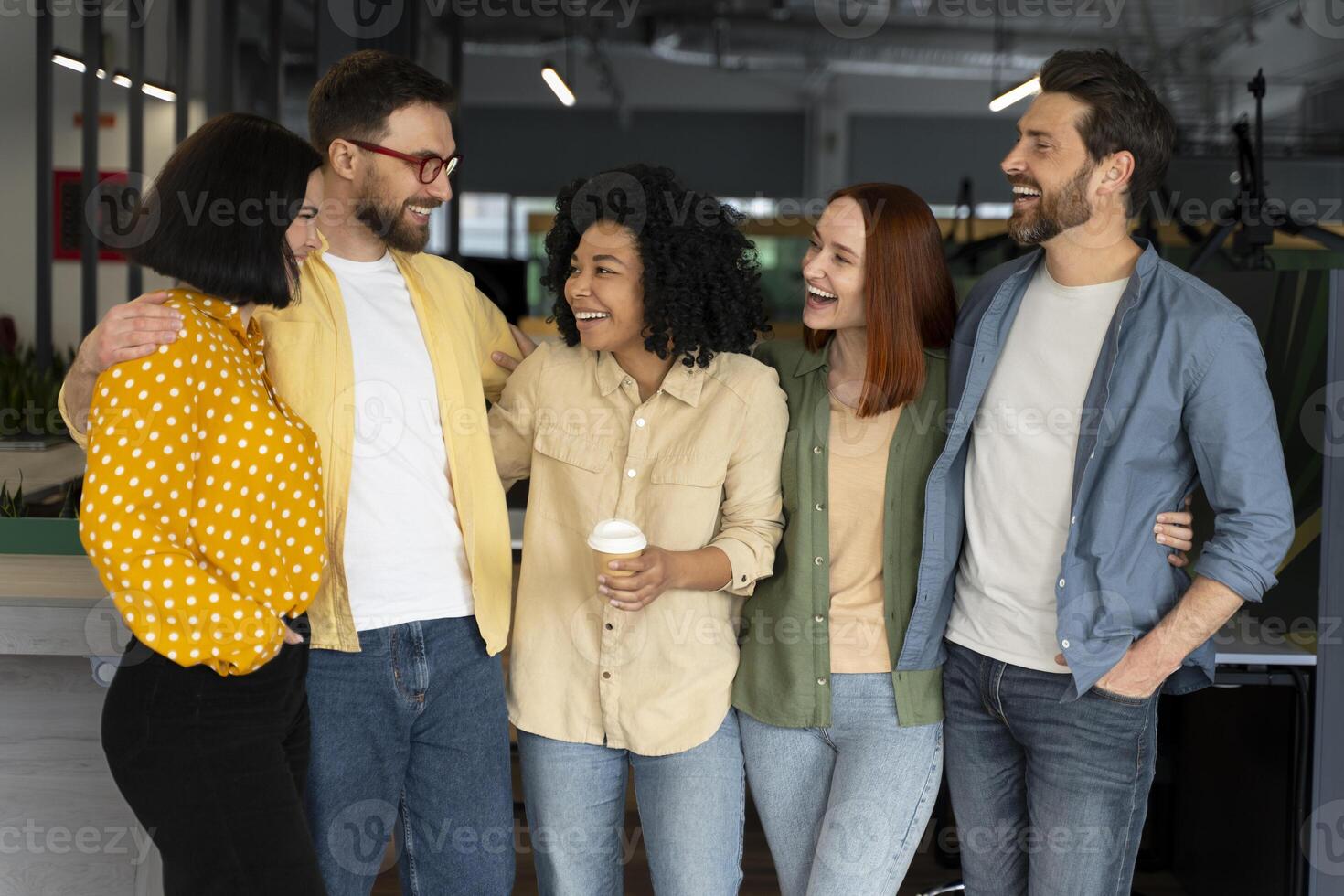 Group of diverse business people smiling and having fun in modern office photo