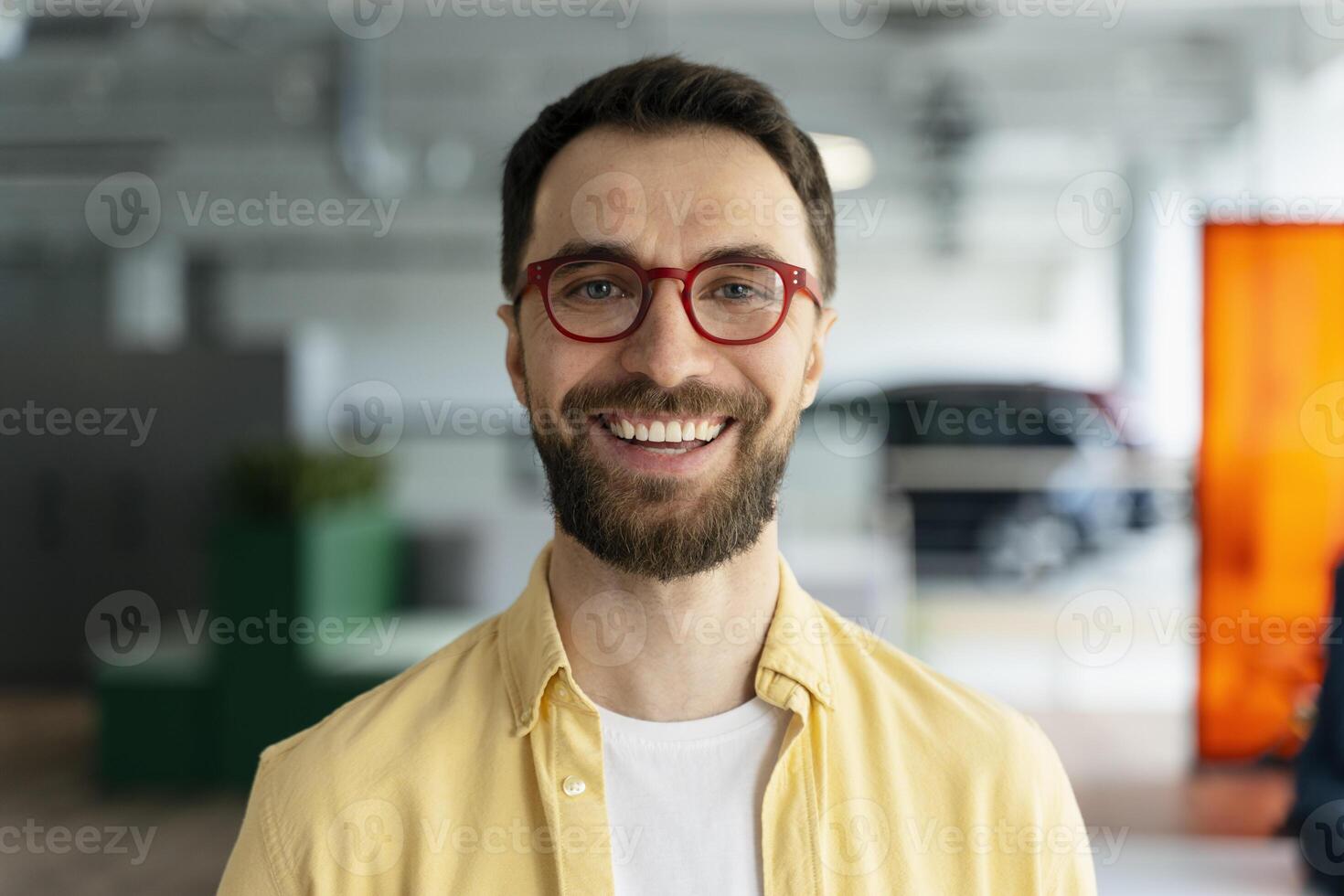 Portrait of a smiling businessman wearing glasses in the office photo