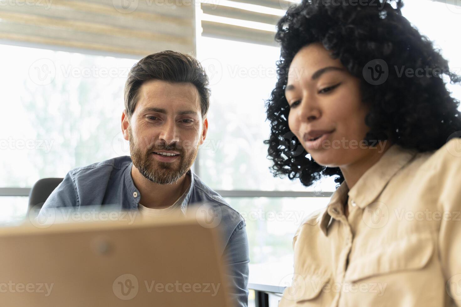 Business people having a meeting and discussing over a digital tablet photo